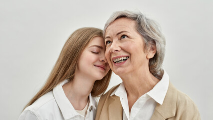 Joyful caucasian girl and her senior grandmother