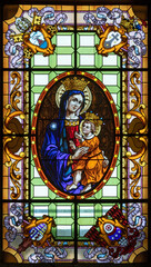 ROME, ITALY - AUGUST 29, 2021: The madonna in the stained glass in the church Chiesa di Santa Maria della Scala by R. Gvarnieri