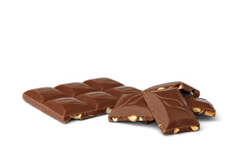 Pieces of chocolate with nuts isolated on white background.