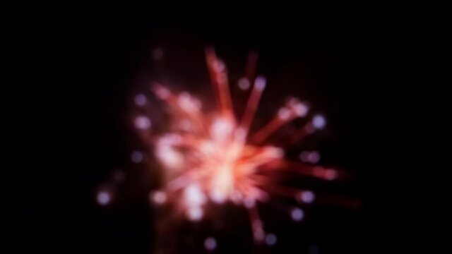 4K. Defocused multi colored fireworks. Bright pyrotechnics show. Holiday background. Concept of Christmas, New Year, Birthday, wedding, 4 july or another festive final. Soft focus. Many explosion.