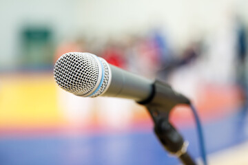 Microphone on a stand, before the performance of athletes in wrestling competitions.