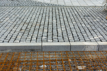 preparatory works for concreting, street paved with setts, construction site