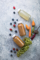 Colorful fruit , vegetables for   smoothies or juices on green  table. Juice and smoothie...