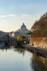Rome, Italy. Vatican dome of Saint Peter Basilica (Italian: San Pietro) and Sant'Angelo Bridge, over Tiber river.
