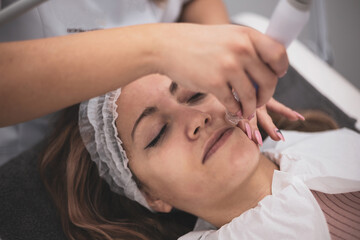 Hydrofacial machine Facial cavitation procedure. Beauty salon treatment. Electric spa equipment....