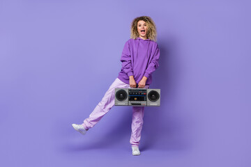Photo of pretty sweet woman wear sweatshirt dancing listening boom box isolated violet color background
