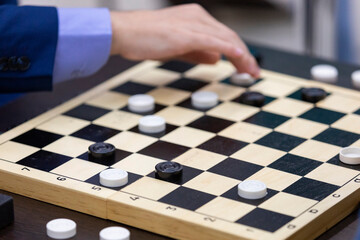 Russia. Sochi. A checkers game session. A board with checkers.