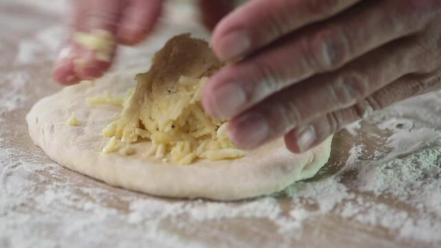 Preparing Khachapuri, cheese bread, traditional caucasian food