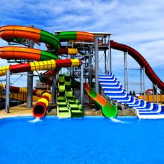 aquapark with slides and a swimming pool. summer holidays.