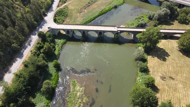 Aerial view of Nineteenth-century bridge over the Yantra River, known as the Kolyu Ficheto Bridge in Byala, Ruse region, Bulgaria