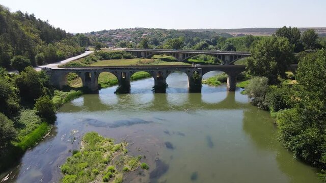 Aerial view of Nineteenth-century bridge over the Yantra River, known as the Kolyu Ficheto Bridge in Byala, Ruse region, Bulgaria