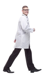 confident doctor with a stethoscope striding forward.