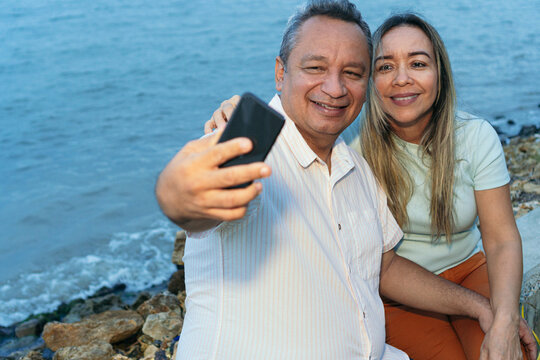 Older Couple Taking A Selfie With Their Mobile