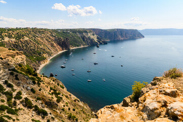 View of the sea bay with yachts from a high cliff. Black Sea, Crimea.