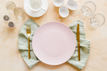 Crockery set - table setting for dinner with dishes and glasses