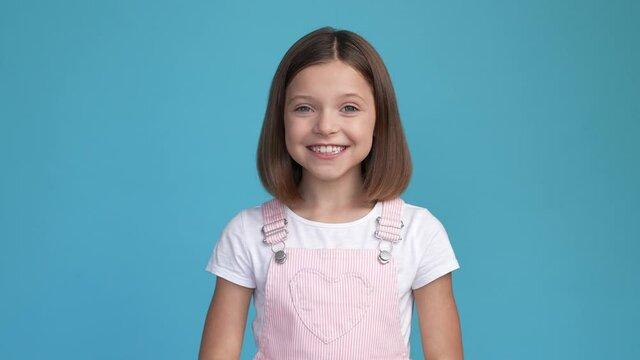 Trendy schoolkid fists up impress omg luck news isolated blue color background
