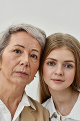 Serious girl and grandmother head to head