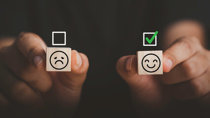 Feedback from customers The check was on a happy face in wood block. Received excellent customer evaluation very satisfied positive customer review concept.