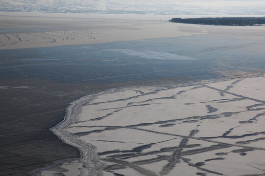 Aerial view of Lake Sevan covered with ice captured in winter