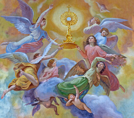 FORLÍ, ITALY - NOVEMBER 11, 2021: The fresco of angels with eucharist in monstrance in the Cattedrala di Santa Croce by Giovanni Secchi (1876 - 1950).