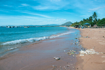 Beautiful beach covered with garbage. Ocean pollution. Protect marine environments.