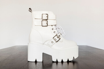 White platform boot with buckles and laces
