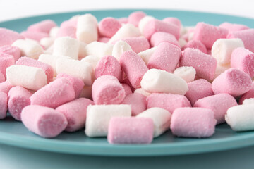 Fototapeta na wymiar Sweet marshmallows topping isolated on white background. Close up