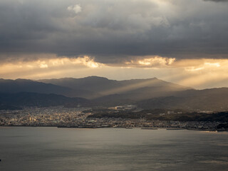 Fototapeta na wymiar 光芒が射す亀老山展望台からの今治市内の風景