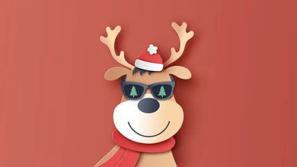  A reindeer wears santa claus costume at Christmas. Handsome reindeer. paper cut and craft style. vector, illustration. © ibom