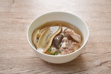 boiled slice Chinese bamboo shoot with pork bone and mushroom soup on bowl