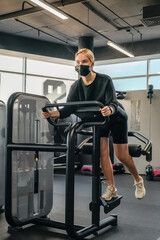 Fitness,sports.fit,Girl in mask fitness gym opening lockdown covid passport,QR cod Wellness, health care,generation z sports recreation concept online fitness apps. workout,training,Fit wellness