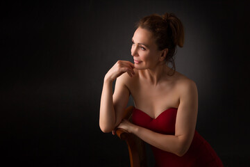 Obraz premium portrait of a sensual fifty year old woman on grey studio background