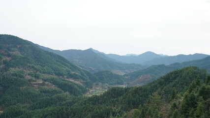 The beautiful mountains view with the fresh green forest in the countryside of the southern China