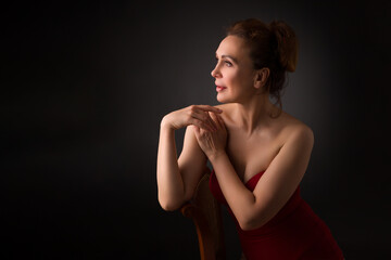 Obraz premium portrait of a sensual fifty year old woman on grey studio background