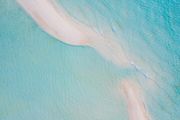 Aerial view of sandbar and blue sea. Maldivian sandbank in Indian ocean, white sandy coast crystal azure color water, perfect getaway for tropical vacations. Top aerial view, calm waves, surf relax