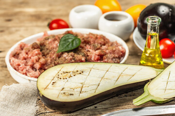 Stuffed eggplant ready to bake with ground meat, vegetables, and spices