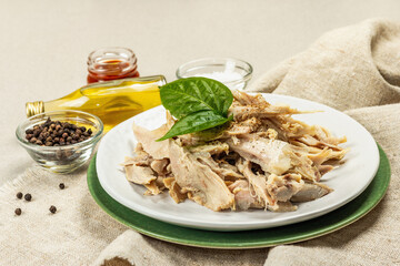 Boiled chicken meat with greens and spices. Low fat animal protein, healthy food lifestyle