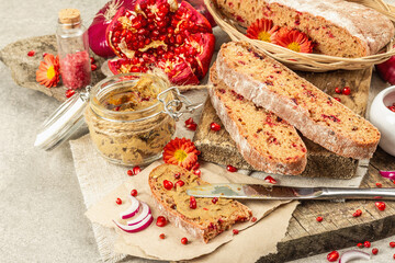 Fresh homemade chicken liver pate or paste in a glass jar with baguette slices on the serving board