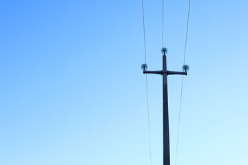 high voltage wire on a concrete pole - electricity transportation concept