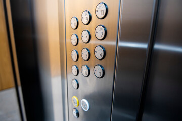 Closeup photo of elevator buttons with selected focus