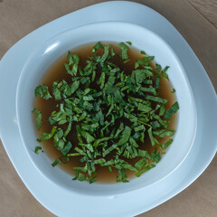 Fototapeta premium Close-up view of mushroom soup with green onions and champignons. Healthy food concepts.