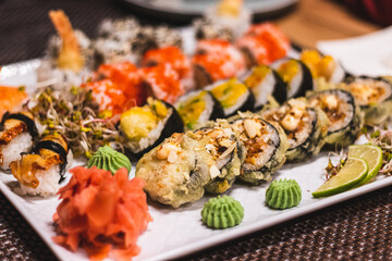 japanese sushi rolls with salmon, ginger and wasabi