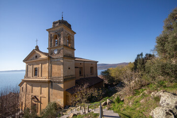 Fototapeta na wymiar Church of the Assumption of Mary in panoramic views ,built around 1500 with The square bell tower.Trevignano Romano,Italy