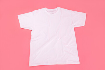 Blank white t-shirt with space for print on pink background