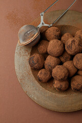 Concept of sweets with truffles on brown background