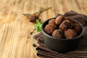 Concept of sweets with truffles on wooden background