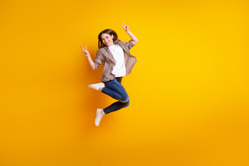 Fototapeta na wymiar Full size profile side photo of young cheerful girl jump rejoice victory success fists hands isolated over yellow color background