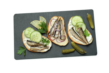 Tray with sandwiches with sprats isolated on white background