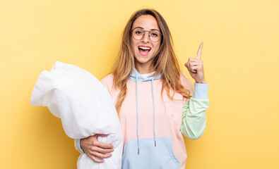 pretty woman feeling like a happy and excited genius after realizing an idea. pajamas concept
