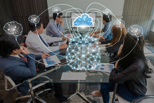 Group Of Asian and Multiethnic Business people brainstorming and working with brain and virtual screen connecting with cloud technolog in the modern workplace, business group and technology concept